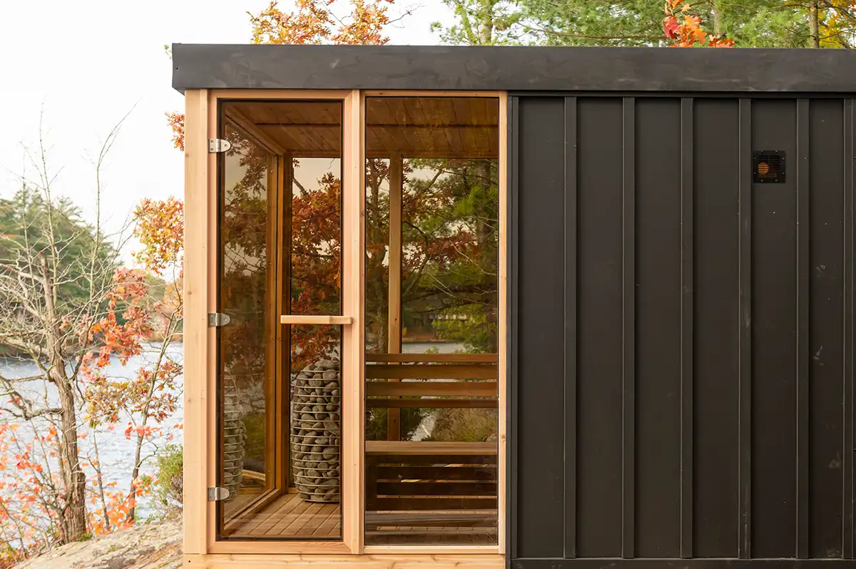 The Pure Cube modern outdoor sauna shown in a garden installation – available at Carr Bank Garden Centre. Pure Cube modern outdoor sauna installation view – luxury outdoor sauna from Carr Bank Garden Centre