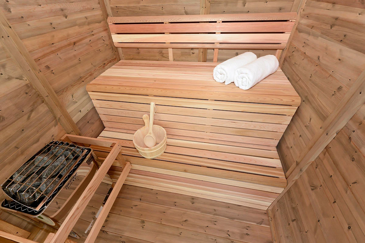 The Pure Cube Collection Sauna with tiered bench seating – available at Carr Bank Garden Centre, Cumbria. Pure Cube Collection Sauna tiered bench interior – indoor outdoor sauna from Carr Bank Garden Centre