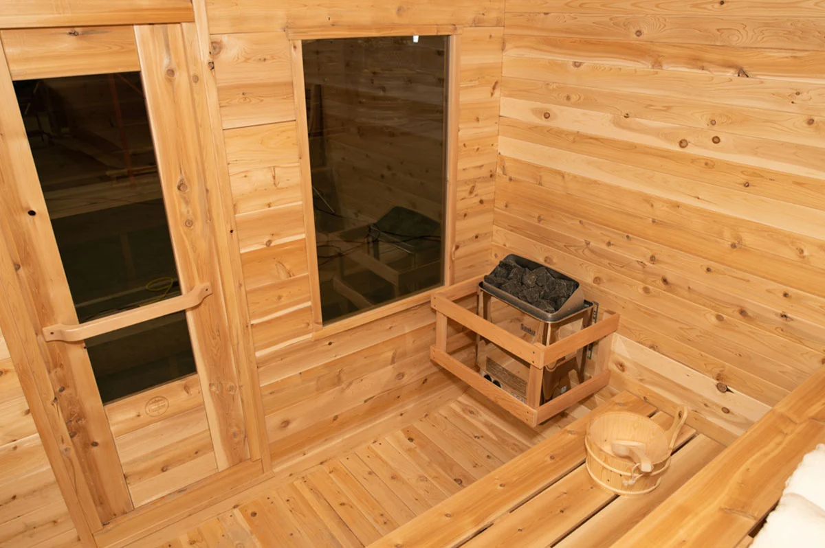 The Luna White Cedar Outdoor Sauna fitted with an electric heater – available at Carr Bank Garden Centre. Luna White Cedar Outdoor Sauna with electric sauna heater – luxury garden sauna from Carr Bank Garden Centre