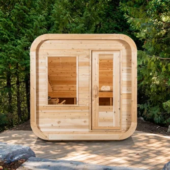 Front view of the Luna White Cedar Outdoor Sauna – available at Carr Bank Garden Centre, Cumbria. Luna White Cedar Outdoor Sauna front view with knotty cedar – luxury garden sauna from Carr Bank Garden Centre