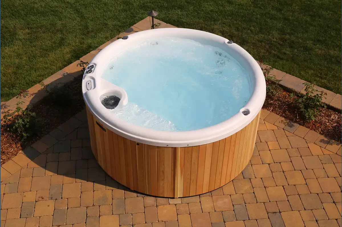 Angle view of the Nordic Classic Series Cedar Hot Tub – available at Carr Bank Garden Centre. Nordic Classic Series Cedar Hot Tub angle view – outdoor cedar hot tub from Carr Bank Garden Centre