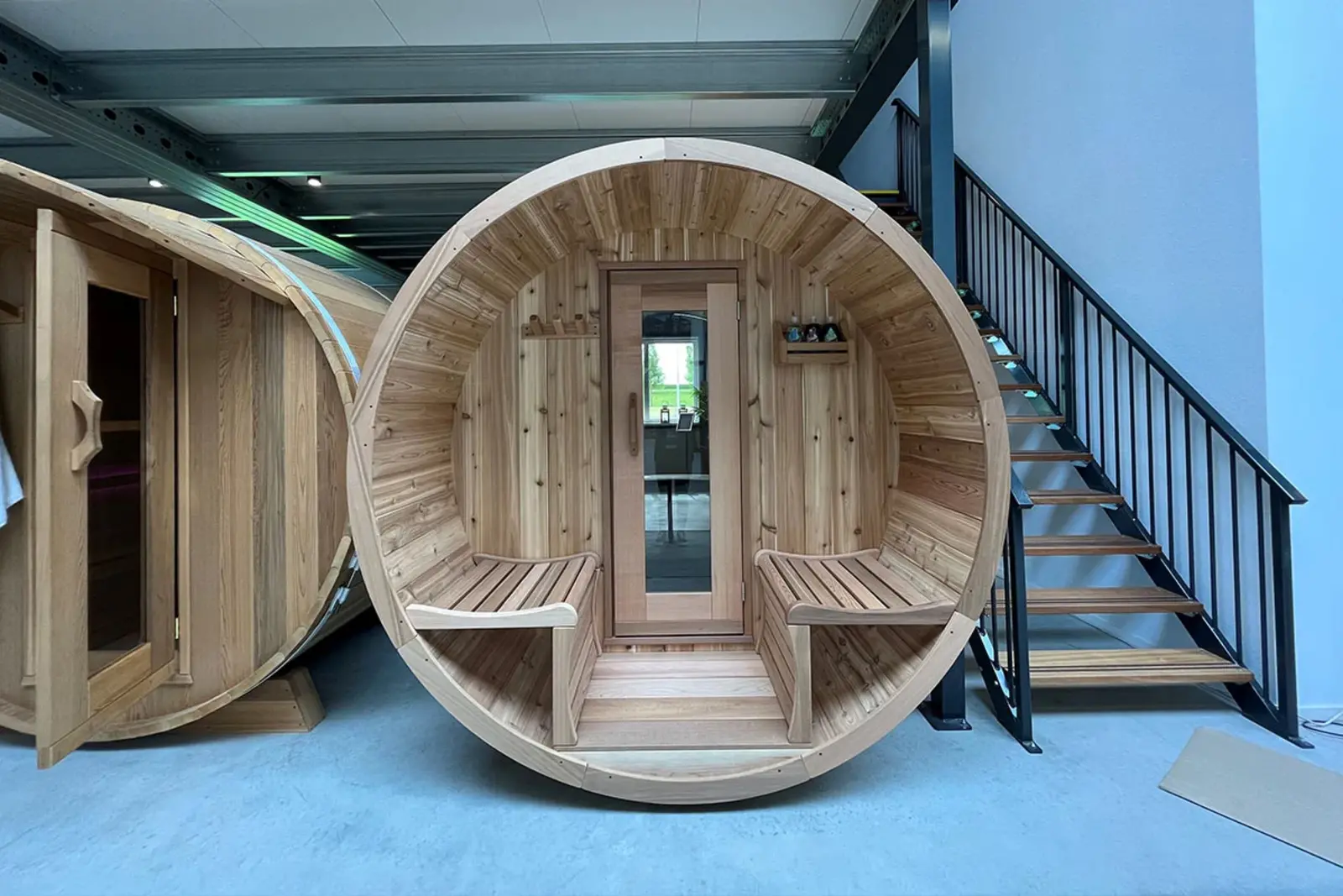 The Panorama Cedar Barrel Sauna with its signature veranda – a stunning outdoor sauna available at Carr Bank Garden Centre. Panorama Cedar Barrel Sauna with veranda exterior – outdoor Red Cedar garden sauna from Carr Bank Garden Centre