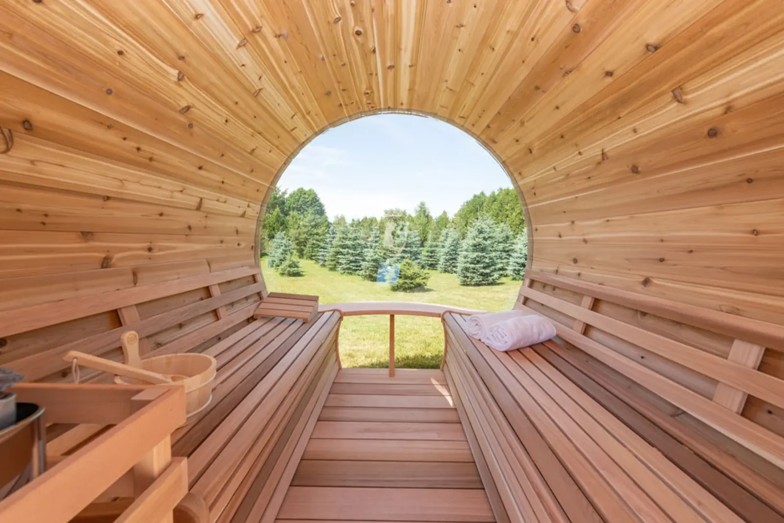Interior of the Panorama Cedar Barrel Sauna with signature bench layout – available at Carr Bank Garden Centre, Cumbria. Panorama Cedar Barrel Sauna interior with signature benches – luxury outdoor sauna from Carr Bank Garden Centre